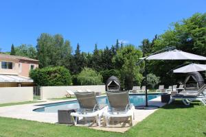 The swimming pool at or close to Le Mas Du Colombier