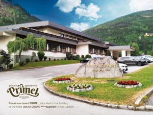 a hotel with a sign in front of a building at Privat Appartement Primel im Hotel in Bad Gastein