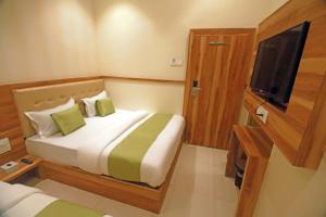 Postel nebo postele na pokoji v ubytování Hotel Al Madina palace