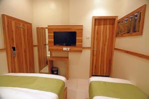 TV a/nebo společenská místnost v ubytování Hotel Al Madina palace