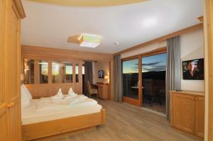 מיטה או מיטות בחדר ב-Hotel Rosslaufhof