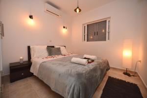 A bed or beds in a room at Villa Verde