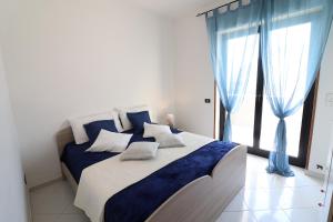 A bed or beds in a room at Giò Otranto holiday home for 6 people