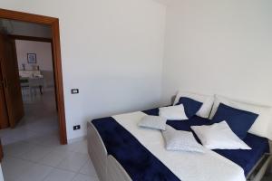 A bed or beds in a room at Giò Otranto holiday home for 6 people