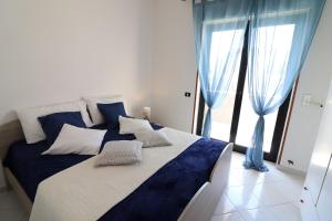 A bed or beds in a room at Giò Otranto holiday home for 6 people