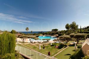 a view of a resort with a swimming pool at Cap Estérel by Actisource in Agay - Saint Raphael