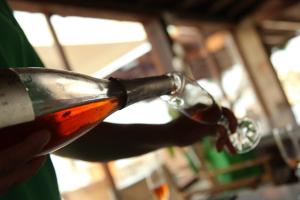 a person is drinking a glass of wine at Irides in Souvala