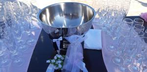 a table with wine glasses and a bucket on it at Irides in Souvala