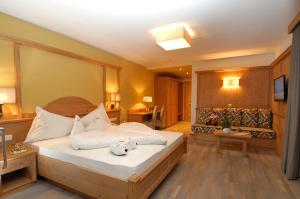 Łóżko lub łóżka w pokoju w obiekcie Hotel Rosslaufhof