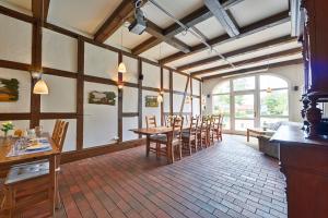 a dining room with a table and chairs at Elbhof Harnisch in Bleckede