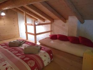 A bed or beds in a room at The "small" Alpine Chalet & Dolomites Retreat