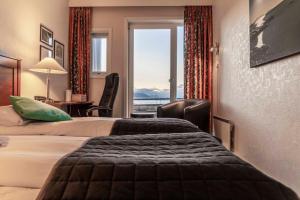 Postel nebo postele na pokoji v ubytování Melbu Hotell