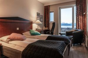 Postel nebo postele na pokoji v ubytování Melbu Hotell
