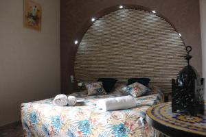 a bed with towels on it in a room at Riad Les Chtis D'Agadir in Agadir