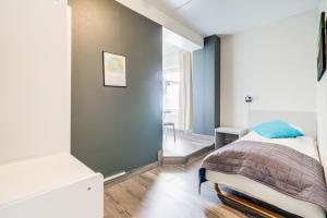 Postel nebo postele na pokoji v ubytování Melbu Hotell