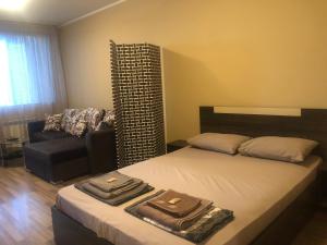 Llit o llits en una habitació de Rakovski Apartment GN / FREE GARAGE