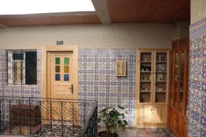 a room with blue and white tiles on a wall at Riad Les Chtis D'Agadir in Agadir