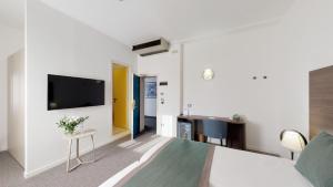 TV a/nebo společenská místnost v ubytování Hotel Villa Sorriso
