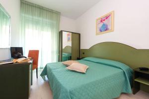 Postel nebo postele na pokoji v ubytování Hotel Sirena