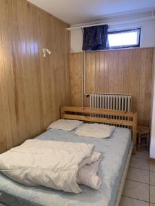 a bedroom with two beds and a window at Boost Your Immo Vars Le Schuss 268 in Vars