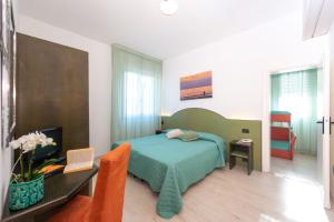 Postel nebo postele na pokoji v ubytování Hotel Sirena
