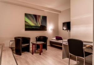 TV a/nebo společenská místnost v ubytování Melbu Hotell