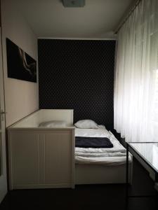 Posteľ alebo postele v izbe v ubytovaní Erdőkerülő Apartman