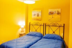 Posteľ alebo postele v izbe v ubytovaní Puerta Bubión Apartamentos