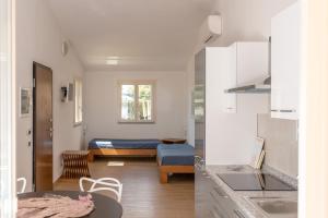 Postel nebo postele na pokoji v ubytování Villa Alessandri - Direttamente sulla Spiaggia