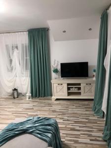 TV a/nebo společenská místnost v ubytování Casa Inna