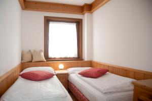 Postel nebo postele na pokoji v ubytování Residence Peniè