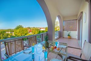 A balcony or terrace at Casa D'Oro Exclusive Villa
