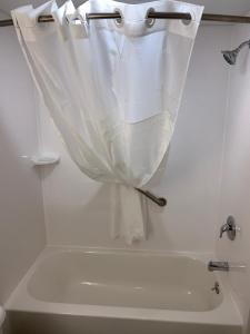 a bathroom sink with a towel hanging from the wall at Best Western West Lebanon-Hanover in West Lebanon