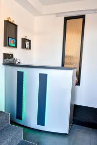 a lobby with a blue and white counter in a room at Casa Mara in Ocna Şugatag