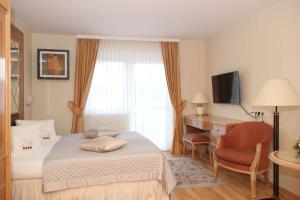 Ένα ή περισσότερα κρεβάτια σε δωμάτιο στο Villa Katharina