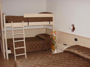A bed or beds in a room at Bellaguarda ROOMS 10min da Tirano