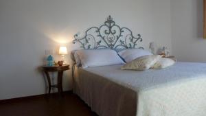 En eller flere senge i et værelse på Agriturismo Colombino