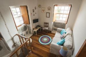 an overhead view of a living room with a couch at Casa da Trigueirinha in Angra do Heroísmo