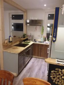 a kitchen with wooden counter tops and a refrigerator at Ferienwohnung Casa Corleone in Apolda