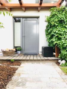 a front door of a house with a wooden porch at Ferienhaus am Tor zur Wachau in Eggendorf