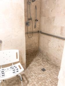 
a bathroom with a toilet and a bath tub at Whitelaw Hotel in Miami Beach
