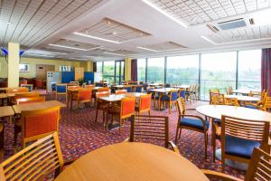 a large dining room with tables and chairs at Holiday Inn Express Bradford City Centre, an IHG Hotel in Bradford
