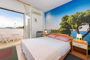 Postel nebo postele na pokoji v ubytování Apartments Pilicari