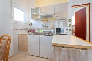 Kuchyň nebo kuchyňský kout v ubytování Apartments Pilicari