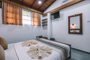 Postel nebo postele na pokoji v ubytování Jungle Paradise