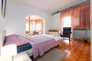 Postel nebo postele na pokoji v ubytování Apartments Pilicari