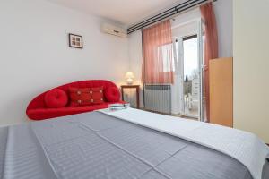 Postel nebo postele na pokoji v ubytování Apartments Pilicari