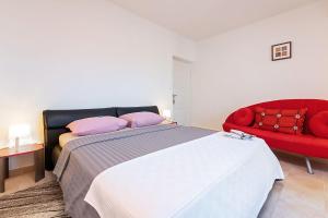 Postel nebo postele na pokoji v ubytování Apartments Pilicari