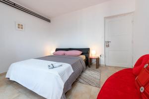 Postel nebo postele na pokoji v ubytování Apartments Pilicari