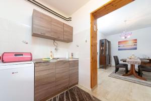 Kuchyň nebo kuchyňský kout v ubytování Apartments Pilicari